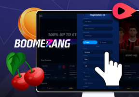Laptop with Boomerangbet signup form, hand on Country menu, gold coin, and cherries in front.